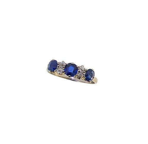Lot 121 - A sapphire and diamond half hoop style ring