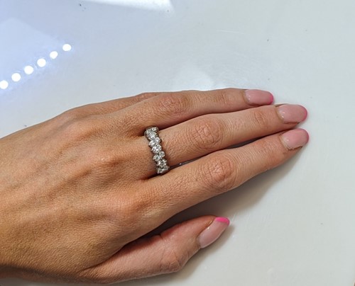Lot 129 - A half hoop style diamond ring