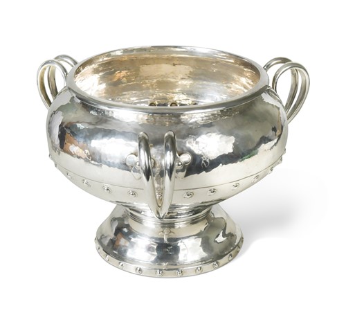 Lot 415 - A George V silver ‘Arts & Crafts’ style 3 handled bowl