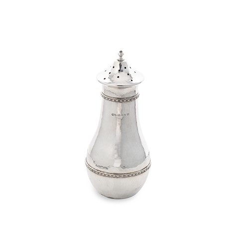 Lot 420 - A George V silver ‘Arts & Crafts’ style caster, mark of A.E. Jones