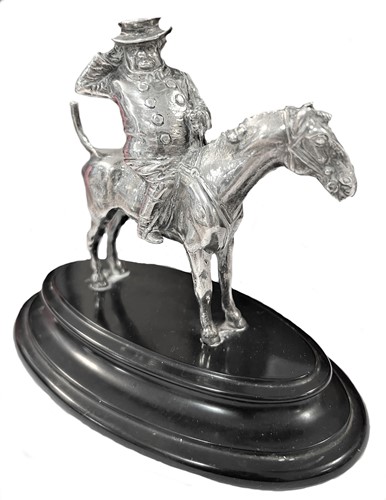Lot 292 - An early 20th century cast silver model of John Bull on horseback