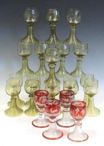 Lot 113 - Eighteen green tinted hock glasses on flared...