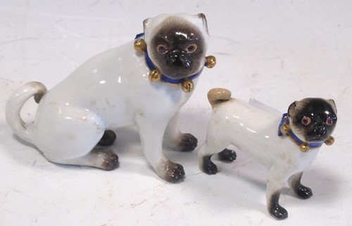 Lot 45 - Two Meissen models of pug dogs, 7cm & 5cm high