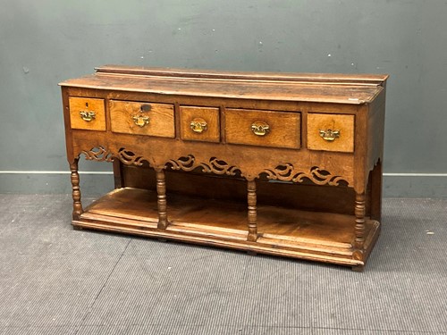 Lot 390 - An 18th century oak dresser base, comprising...