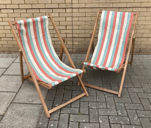 Lot 364 - A pair of vintage deck chairs with striped...