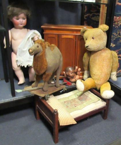 Lot 83 - A straw stuffed pull along vintage camel, a...