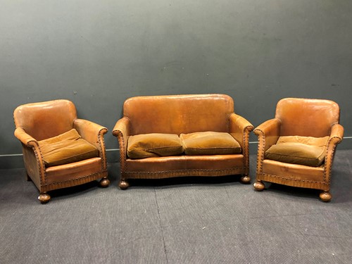 Lot 366 - A 1920s leather lounge suite of a two seater...