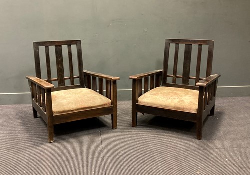 Lot 367 - A pair of 1920s stained wood low armcahirs...