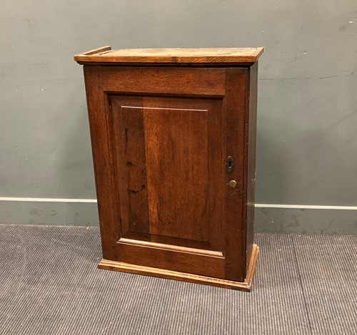 Lot 399 - A 19th century oak wall cupboard with hinged...