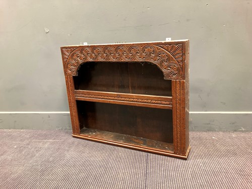 Lot 398 - A 17th century style carved oak wall shelf...