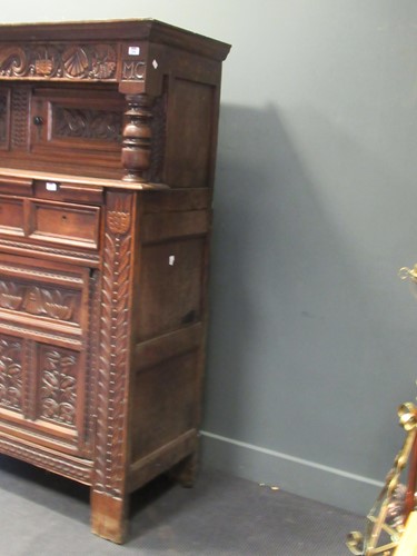 Lot 387 - An early 18th century oak court cupboard,...