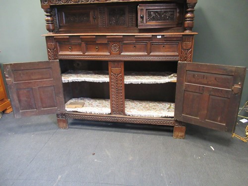 Lot 387 - An early 18th century oak court cupboard,...