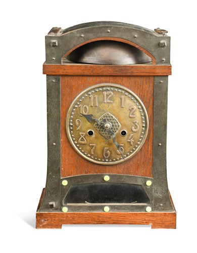 Lot 121 - An Arts & Crafts oak mantle clock, probably retailed by Liberty & Co.