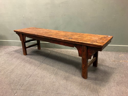Lot 535 - An elm low table with shaped frieze, 51 x 178...