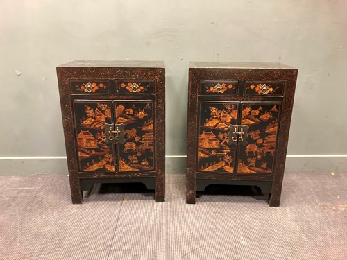 Lot 510 - A pair of black lacquered bedside cabinets...