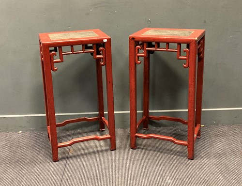 Lot 527 - A pair of red lacquered urn stands with inset...