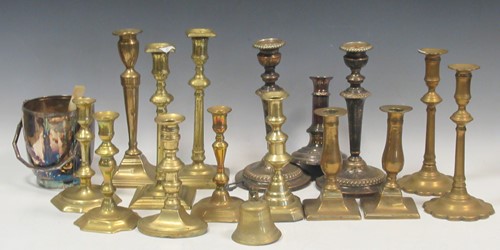 Lot 120 - A collection of brass candlesticks, including...