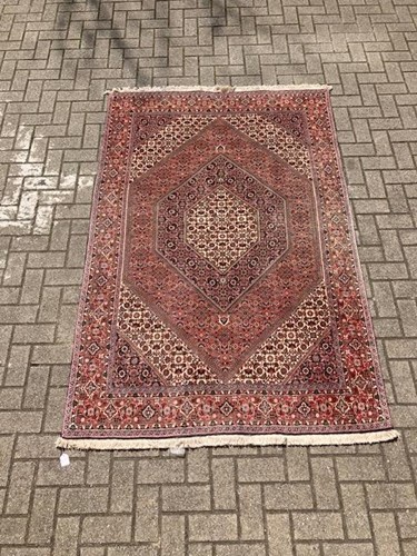 Lot 555 - A Bidjar red-ground carpet, 215 x 139cm