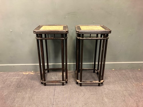 Lot 512 - A pair of black lacquered urn stands with...