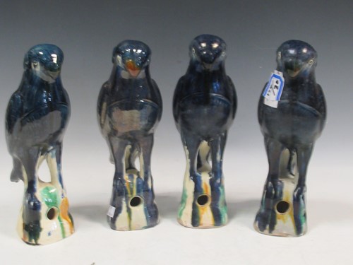 Lot 24 - Four earthenware blue glazed birds, approx...