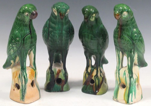 Lot 18 - Four earthenware green glazed birds, approx...