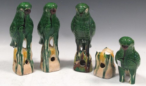 Lot 30 - Four earthenware green glazed birds, approx...