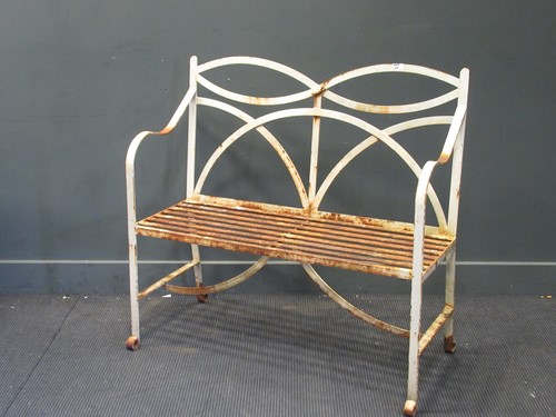 Lot 548 - A Regency style wrought iron strapwork garden...