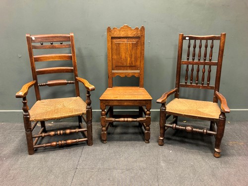 Lot 337 - Two North Country rush seat armchairs and an...
