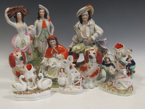 Lot 82 - A collection of Staffordshire figures,...