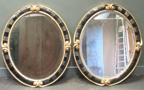 Lot 310 - A pair of 20th century gilt and black oval...