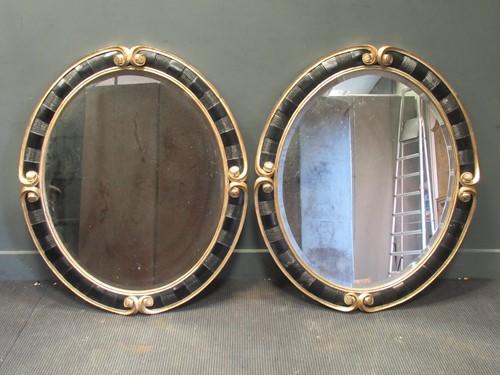 Lot 314 - A pair of 20th century gilt and black oval...