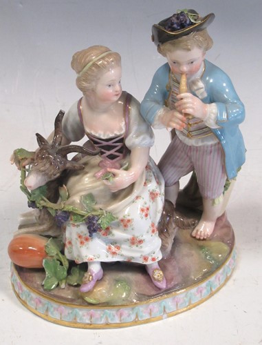 Lot 43 - A 19th century Meissen figural group of a boy...