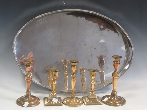 Lot 131 - Five 20th century brass candlesticks together...