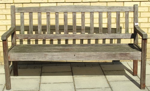 Lot 441 - A late 20th century teak garden bench, 88 x...