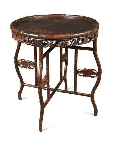 Lot 465 - A Chinese carved hardwood circular occasional table, late 19th / early 20th century