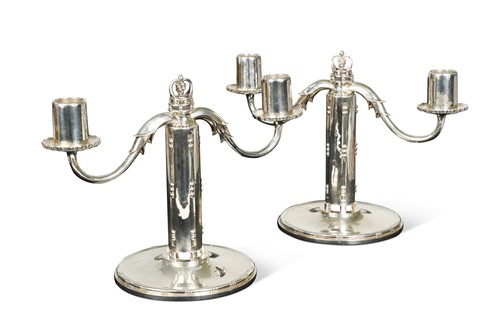 Lot 111 - Georg Jensen, a pair of silver twin-branch candelabra