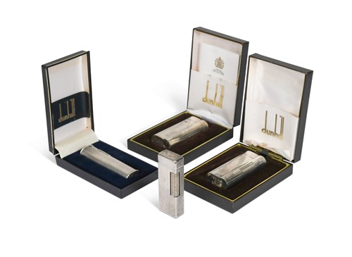 Lot 106 - A group of four Dunhill electroplate pocket lights, three boxed