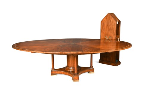 Lot 534 - A mahogany and crossbanded Jupe type extending dining table, 20th century