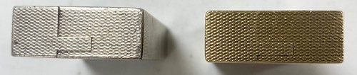Lot 108 - A 9ct gold pocket lighter by A D Bach and another silver example