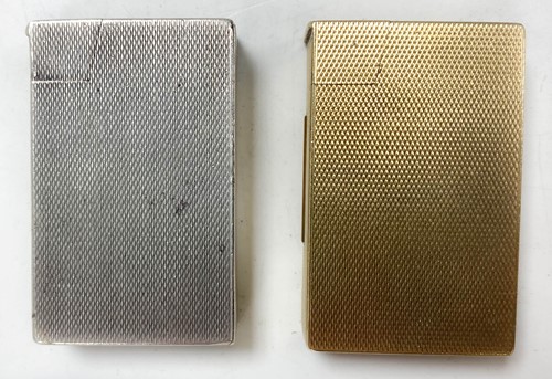 Lot 108 - A 9ct gold pocket lighter by A D Bach and another silver example