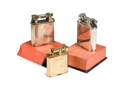 Lot 109 - An early 9ct gold Dunhill 'Unique' pocket lighter, and two later boxed electroplate versions