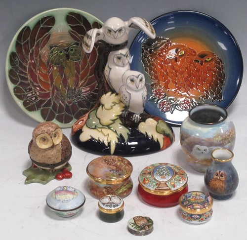 Lot 11 - A Moorcroft pottery model of three owls, two...