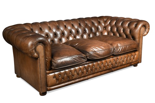 Lot 665 - A Chesterfield three-seater sofa by Flemming and Howland, modern