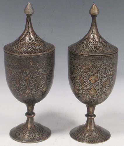 Lot 14 - A pair of Indian Mughal-style inlaid metal...