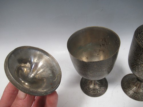 Lot 14 - A pair of Indian Mughal-style inlaid metal...