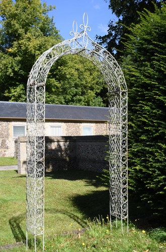 Lot 683 - A green painted wire work garden rose arch