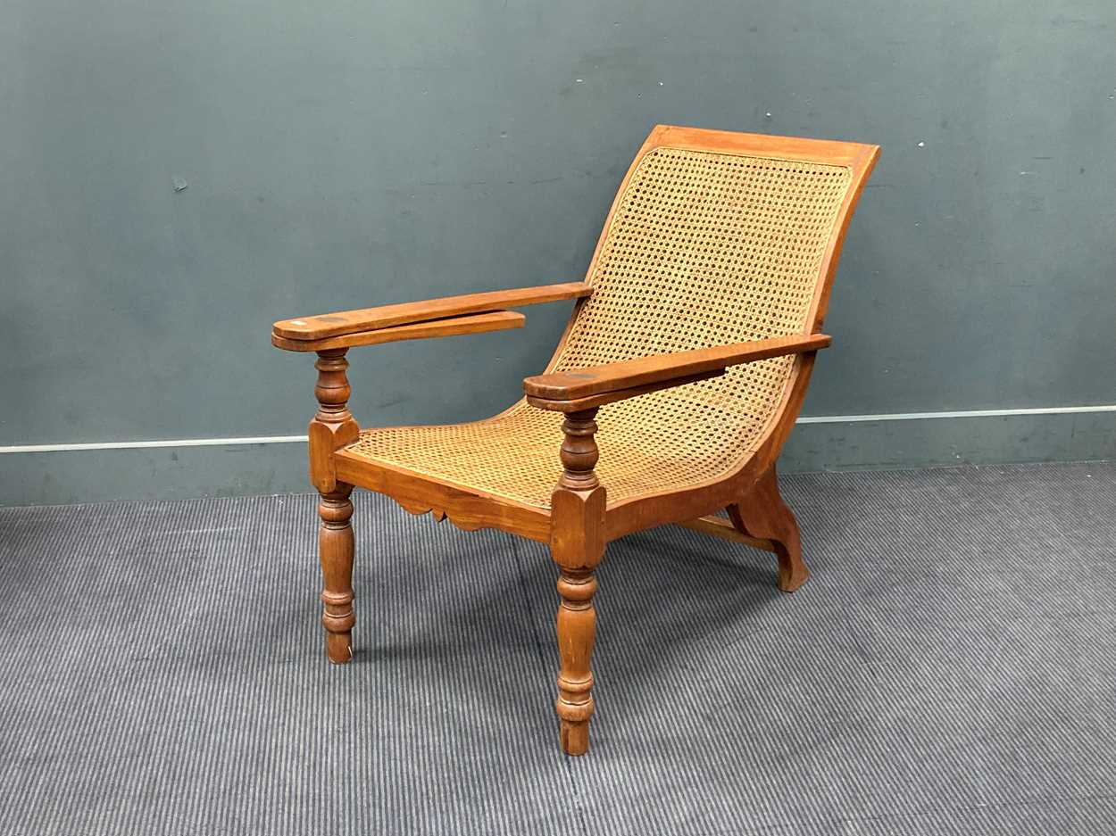 Lot 333 - A teak plantation chair, early 20th century,...