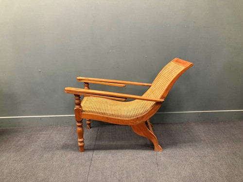 Lot 333 - A teak plantation chair, early 20th century,...