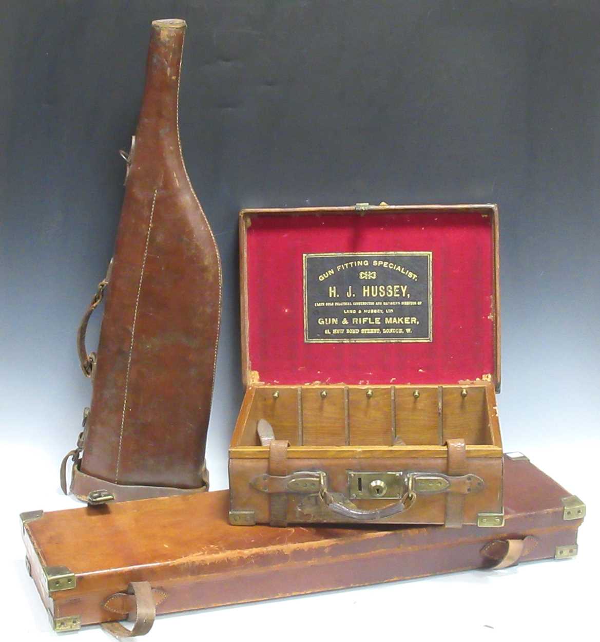 Lot 101 - A Lang & Hussey leather and oak cartridge box...