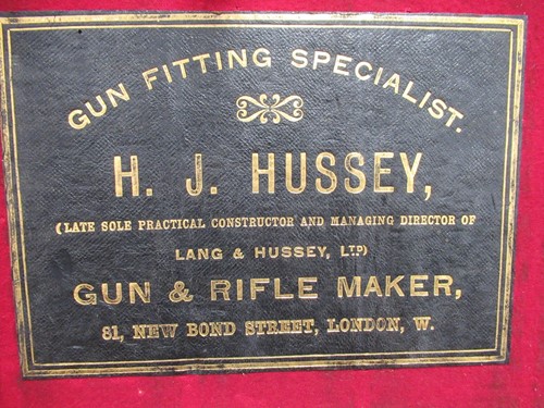 Lot 101 - A Lang & Hussey leather and oak cartridge box...